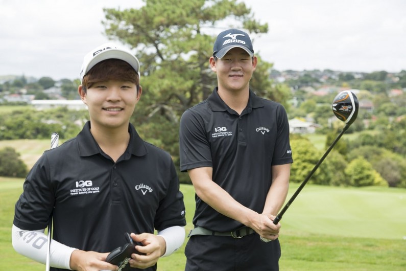 Two young people playing golf