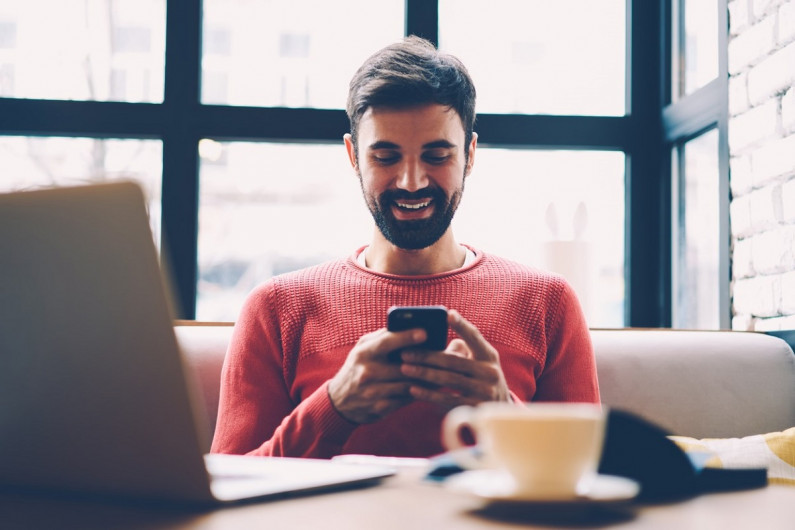 man reading cell phone iStock 904837528