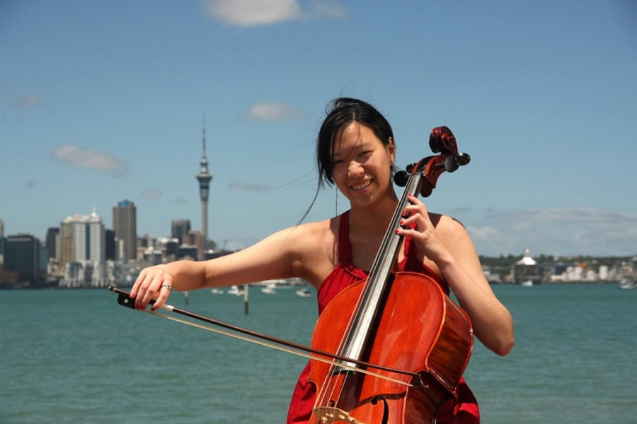 A violinist plays on the Auckland waterfront
