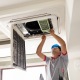 man repairs air conditioner