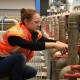 a water treatment operator checks valves at a treatment plant