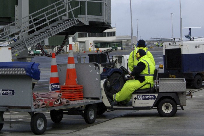 Aircraft loaders working on the tarmac at Wellington Airport