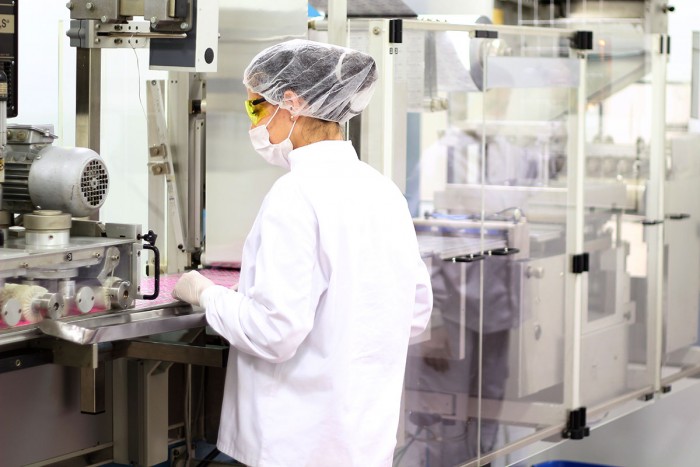 Chemical production operator oversees a production line in a factory