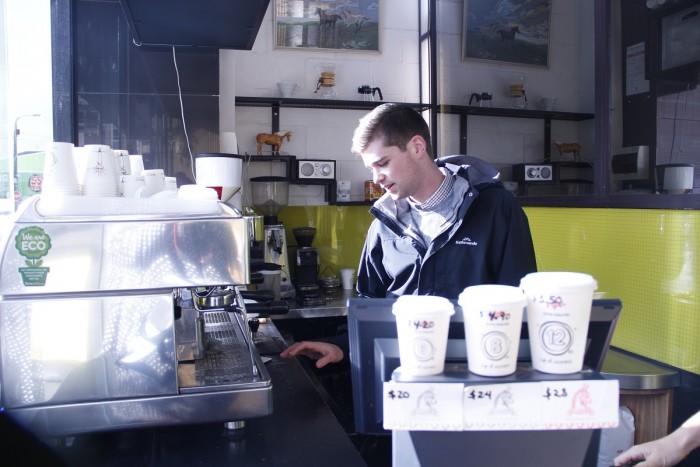 Jack Heagney checks a coffee machine inside a new cafe