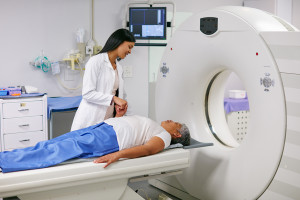 A medical Imaging technologist talks to a patient before they enter an MRI