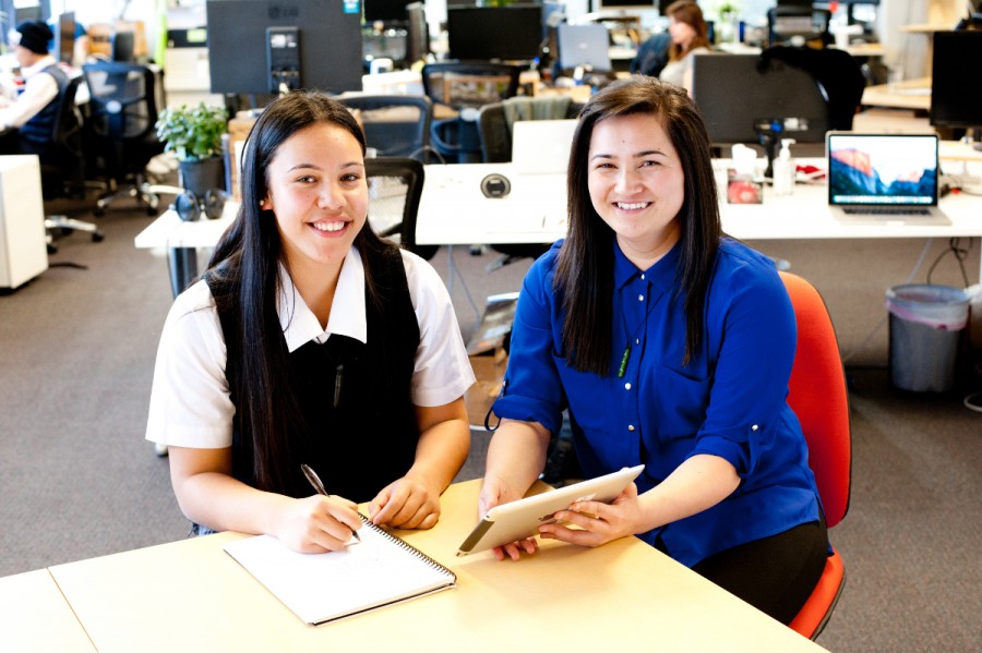 Two Maori students study at a desk