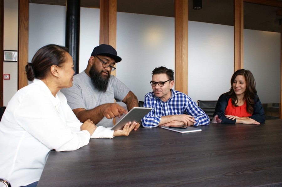 Four people at a board meeting