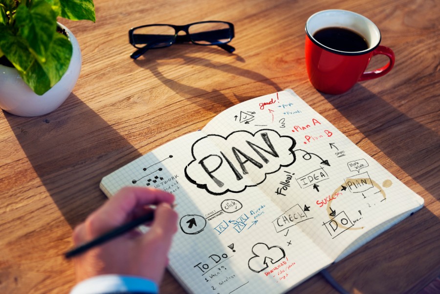 A planning book is open on a desk